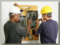 Two electricians working together