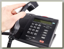 Man hanging up a telephone