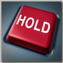 A "Hold" button on a business telephone